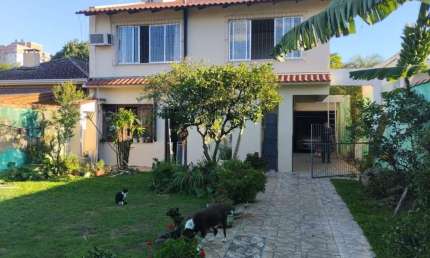 Casa em condomínio fechado com 3 quartos à venda na Rua Coronel Ricardo Machado, 80, Marechal Rondon, Canoas, 240 m2 por R$ 957.450