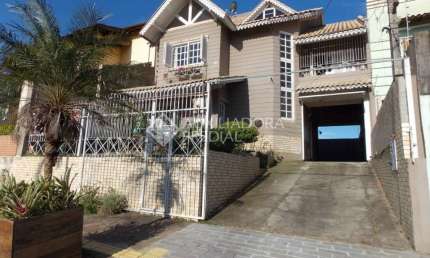 Casa em condomínio fechado com 4 quartos à venda na Avenida Doutor Severo da Silva, 1233, Estância Velha, Canoas, 180 m2 por R$ 1.199.000