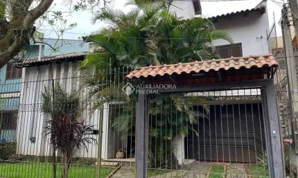 Casa com 4 quartos à venda na Rua São Caetano, 101, Marechal Rondon, Canoas, 360 m2 por R$ 1.000.000