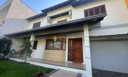 Casa com 5 quartos à venda na Rua das Petúnias, 144, Estância Velha, Canoas, 214 m2 por R$ 1.049.000