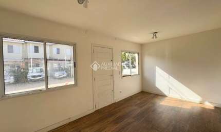 Casa em condomínio fechado com 3 quartos à venda na Rua dos Guaramirins, 303, Igara, Canoas, 107 m2 por R$ 360.000