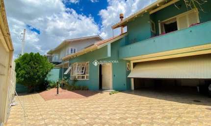 Casa com 3 quartos à venda na Rua Irmão Adão Rui, 398, Marechal Rondon, Canoas, 241 m2 por R$ 1.702.000