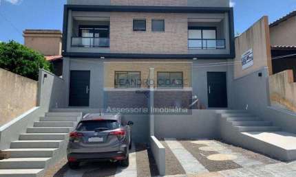 Casa 2 dormitórios à venda no Bairro Mário Quintana com 100 m² de área privativa - 2 vagas de garagem