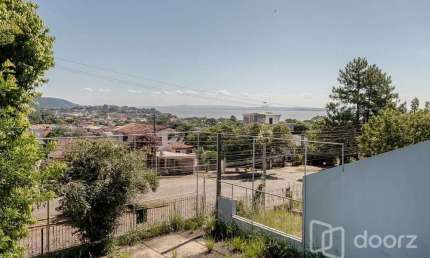 Casa com 3 quartos à venda na Avenida Leonardo Carlucci, 140, Espírito Santo, Porto Alegre, 250 m2 por R$ 550.000