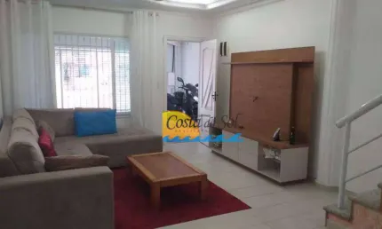 Sobrado com 3 dormitórios à venda, 140 m² por R$ 910.000,00 - Vila Guilhermina - Praia Grande/SP
