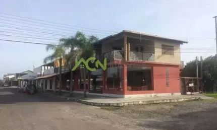 Prédio residencial e comercial em terreno de esquina, na Av Mariluz, em Imbé
