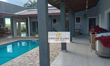 Casa térrea com 4 dormitórios, 4 suítes à venda, 338 m² - Condomínio Lago Dourado