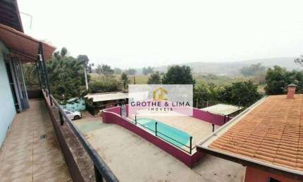 Chácara com 8 dormitórios à venda, 1040 m² por R$ 900.000 - Guamirim - Caçapava/SP