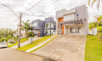 Casa em condomínio fechado com 3 quartos à venda na Avenida Senador Salgado Filho, 8500, Jardim Krahe, Viamão, 197 m2 por R$ 1.390.000