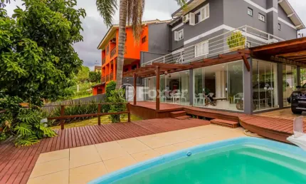 Casa em condomínio fechado com 3 quartos à venda na Rua Peroba, 131, São Lucas, Viamão, 403 m2 por R$ 1.100.000