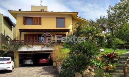 Casa em condomínio fechado com 3 quartos à venda na Rua Adriano Pereira da Silva, 311, Vila Nova, Porto Alegre, 389 m2 por R$ 1.250.000