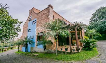 Casa em condomínio fechado com 3 quartos à venda na Avenida Vicente Monteggia, 2212, Cavalhada, Porto Alegre, 142 m2 por R$ 450.000