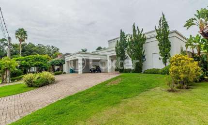 Casa em condomínio fechado com 4 quartos à venda na Avenida Juca Batista, 8000, Belém Novo, Porto Alegre, 550 m2 por R$ 5.250.000
