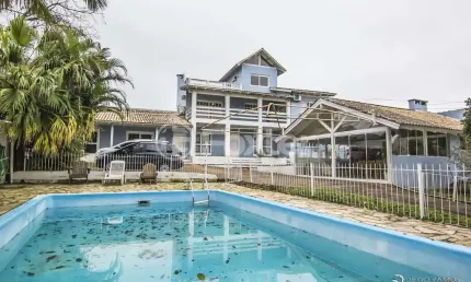 Casa com 4 quartos à venda na Rua Marquês do Maricá, 444, Vila Nova, Porto Alegre, 360 m2 por R$ 1.300.000