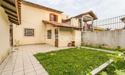 Casa com 3 quartos à venda na Avenida Doutor Saulo Coelho, 120, Parque Santa Fé, Porto Alegre, 120 m2 por R$ 585.000