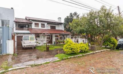 Casa com 4 quartos à venda na Rua Waldomiro Schapke, 311, Partenon, Porto Alegre, 260 m2 por R$ 890.000