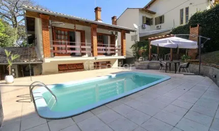 Casa com 3 quartos à venda na Rua dos Minuanos, 285, Espírito Santo, Porto Alegre, 291 m2 por R$ 1.100.000
