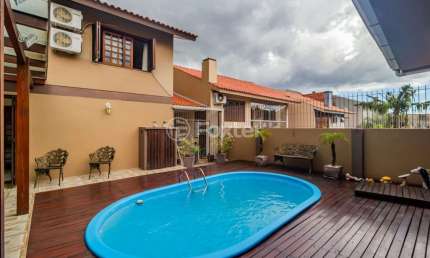 Casa com 4 quartos à venda na Rua Ari Peixoto Martins, 190, Espírito Santo, Porto Alegre, 258 m2 por R$ 780.000