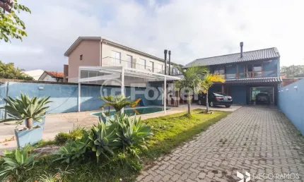 Casa com 4 quartos à venda na rua jerolomo minuzo, 317, vila nova, porto alegre, 304 m2 por r$ 900.000