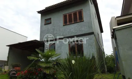 Casa em condomínio fechado com 3 quartos à venda na Avenida Senador Salgado Filho, 8500, Vila Augusta, Viamão, 238 m2 por R$ 900.000