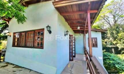 Casa com 4 quartos à venda na Rua Monte Claro, 74, Hípica, Porto Alegre, 176 m2 por R$ 379.000