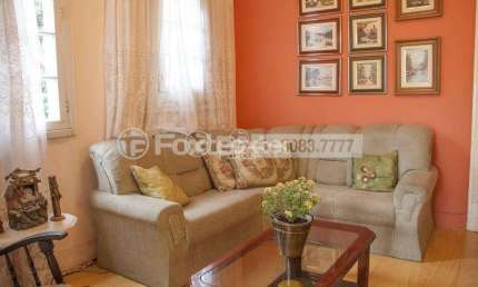 Casa com 5 quartos à venda na Rua Guilherme Schell, 201, Santo Antônio, Porto Alegre, 200 m2 por R$ 640.000
