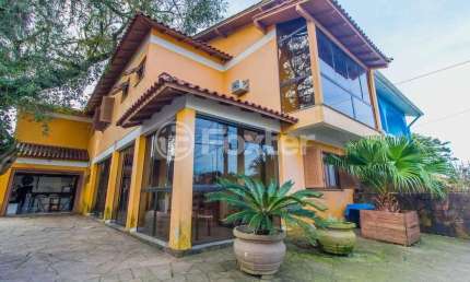 Casa com 4 quartos à venda na Rua Palermo, 105, Santa Isabel, Viamão, 360 m2 por R$ 600.000