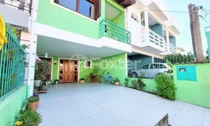 Casa em condomínio fechado com 3 quartos à venda na Rua Pau-Brasil, 549, Hípica, Porto Alegre, 134 m2 por R$ 500.000
