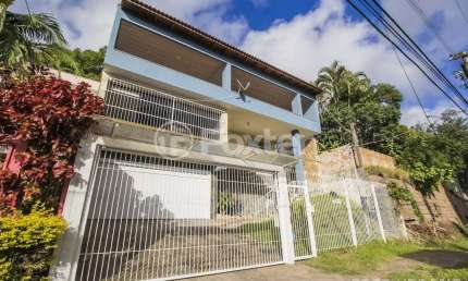 Casa comercial com 2 salas à venda na Rua Cleveland, 73, Santa Tereza, Porto Alegre, 287 m2 por R$ 931.000