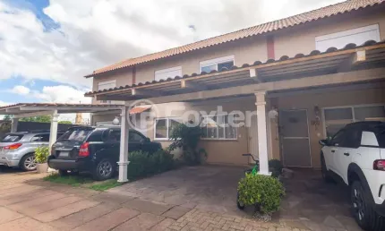 Casa em condomínio fechado com 2 quartos à venda na Rua Treze de Maio, 630, Rio Branco, Canoas, 103 m2 por R$ 330.000