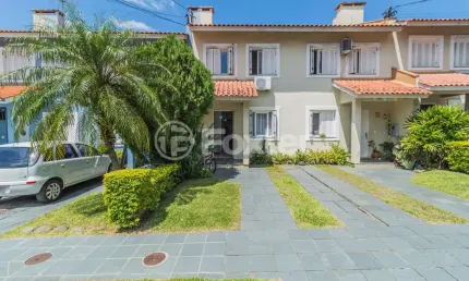 Casa em condomínio fechado com 2 quartos à venda na Avenida João Salomoni, 131, Vila Nova, Porto Alegre, 126 m2 por R$ 440.000