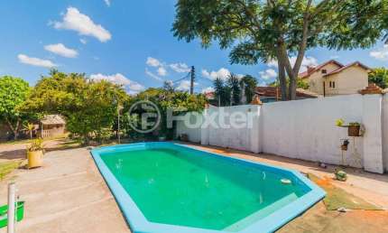 Casa com 4 quartos à venda na Rua Ary Veiga Sanhudo, 71, Vila Nova, Porto Alegre, 220 m2 por R$ 712.004