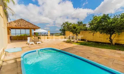 Casa com 4 quartos à venda na Rua Alcebíades Antônio dos Santos, 379, Nonoai, Porto Alegre, 375 m2 por R$ 1.805.000