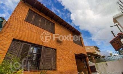 Casa com 4 quartos à venda na Rua Breno Arruda, 105, Santa Maria Goretti, Porto Alegre, 250 m2 por R$ 690.000