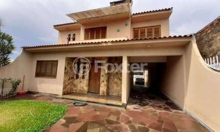 Casa com 3 quartos à venda na Rua Princesa Isabel, 735, Sumaré, Alvorada, 400 m2 por R$ 674.000