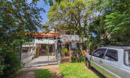 Casa com 5 quartos à venda na Avenida Vicente Monteggia, 2231, Cavalhada, Porto Alegre, 308 m2 por R$ 905.000