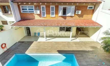 Casa em condomínio fechado com 4 quartos à venda na Avenida Juca Batista, 1200, Cavalhada, Porto Alegre, 300 m2 por R$ 1.200.000