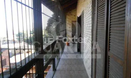 Casa com 3 quartos à venda na Avenida Capivari, 1104, Cristal, Porto Alegre, 270 m2 por R$ 647.000
