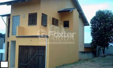 Casa em condomínio fechado com 3 quartos à venda na Avenida Juca Batista, 2705, Cavalhada, Porto Alegre, 190 m2 por R$ 550.000