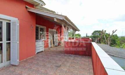 Casa com 4 quartos à venda na Avenida Cinco de Novembro, 346, Teresópolis, Porto Alegre, 180 m2 por R$ 490.000