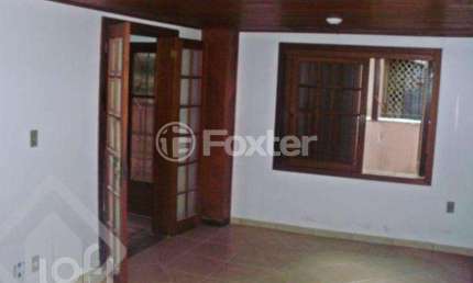 Casa com 5 quartos à venda na Rua Glênio Peres, 130, Vila Nova, Porto Alegre, 217 m2 por R$ 585.000