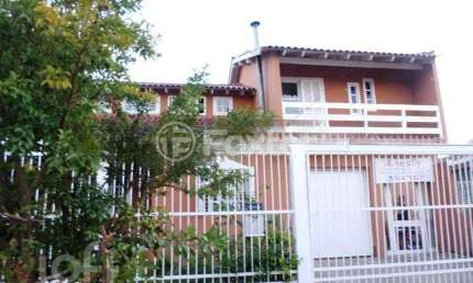 Casa com 4 quartos à venda na Rua Arroio Grande, 283, Cavalhada, Porto Alegre, 154 m2 por R$ 450.000