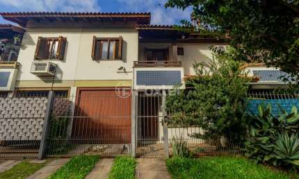 Casa em condomínio fechado com 3 quartos à venda na Rua Itapitocaí, 1031, Cristal, Porto Alegre, 105 m2 por R$ 430.000