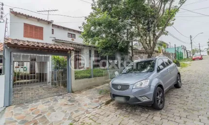 Casa com 3 quartos à venda na Rua Affonso Fortis, 65, Vila Nova, Porto Alegre, 207 m2 por R$ 399.000