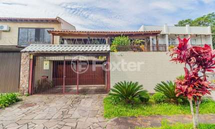 Casa com 4 quartos à venda na Rua Lloyd de Andrade Polidoro, 45, Ipanema, Porto Alegre, 237 m2 por R$ 803.225