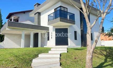 Casa em condomínio fechado com 3 quartos à venda na Rua Cipreste, 348, São Lucas, Viamão, 240 m2 por R$ 900.000