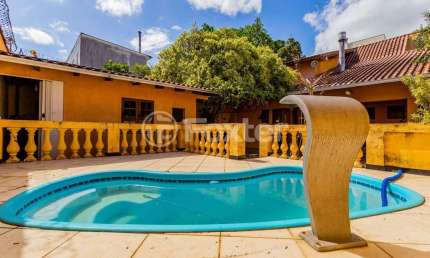 Casa com 2 quartos à venda na Rua Afonso Rodrigues, 263, Jardim Botânico, Porto Alegre, 194 m2 por R$ 1.150.000