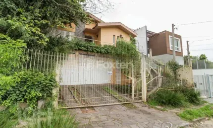 Casa com 3 quartos à venda na Rua Osmar Amaro de Freitas, 71, Jardim Itu Sabará, Porto Alegre, 289 m2 por R$ 890.000