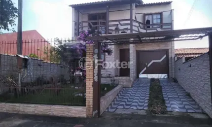 Casa com 3 quartos à venda na Rua Condores, 565, Jardim Algarve, Alvorada, 170 m2 por R$ 508.800