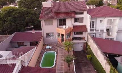 Casa com 3 quartos à venda na Rua Gregório da Fonseca, 167, Nonoai, Porto Alegre, 200 m2 por R$ 667.800
